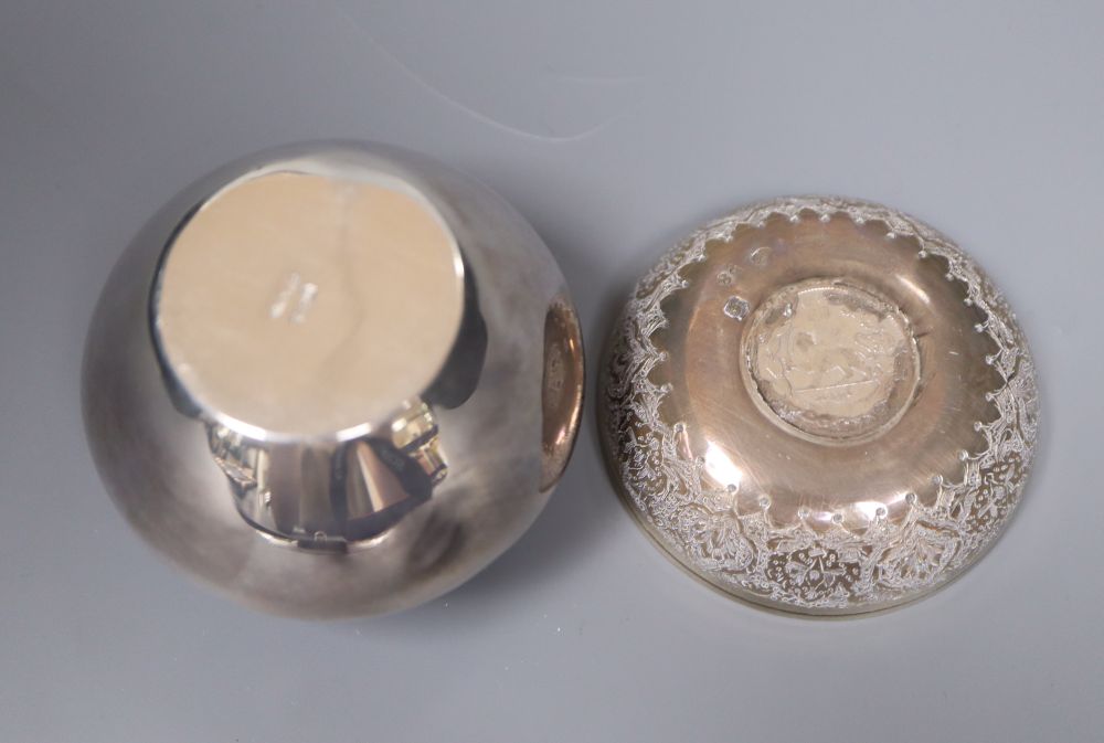 A small Persian white metal dish with inset coin, 67mm, a sterling small vase and a modern silver photograph frame.